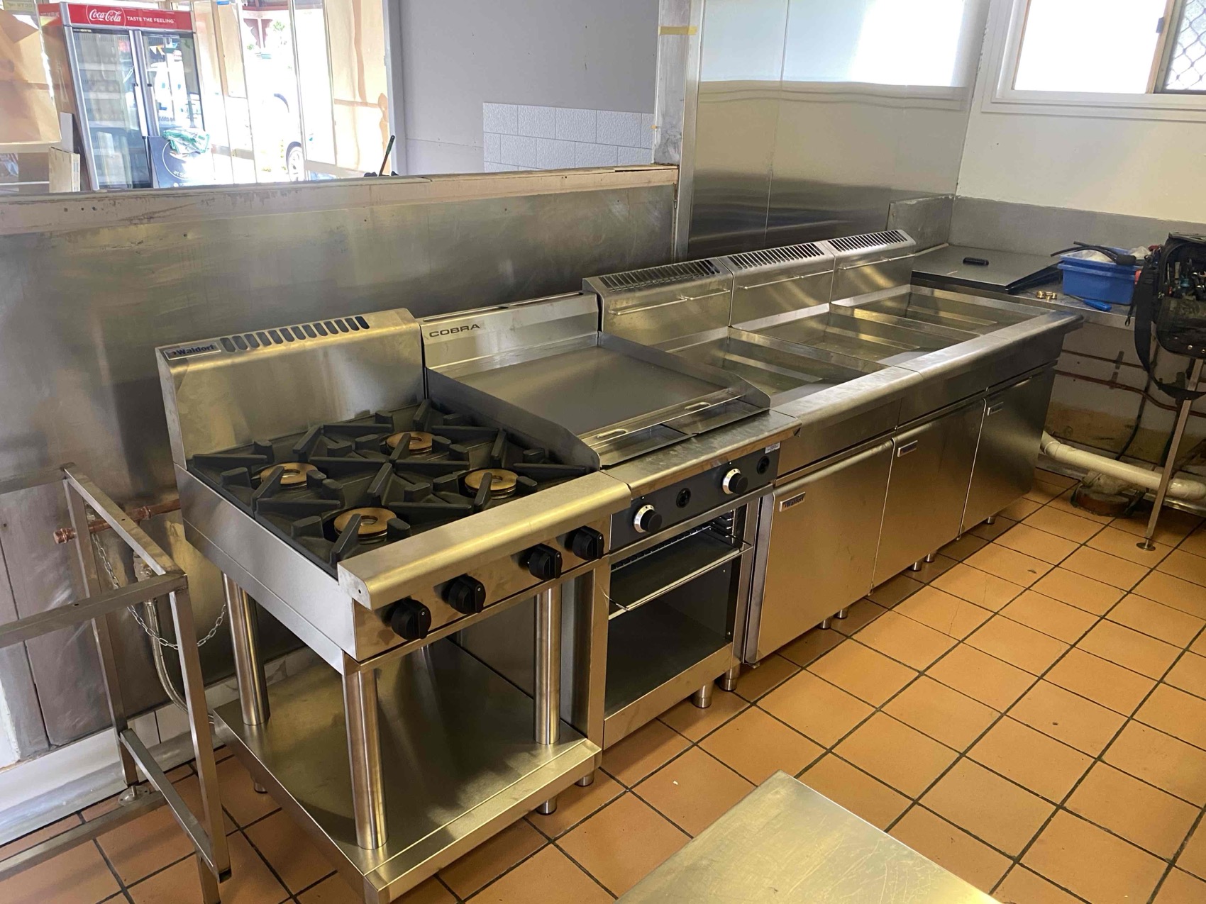 RHQ technician working on commercial refrigeration equipment